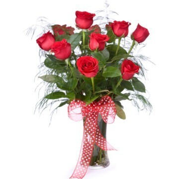 Summer Breeze - $68. A dozen roses in your choice of color. Presented in a glass vase tied with a silk bow.